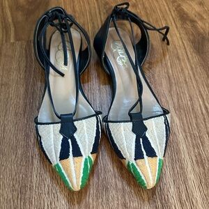 Elegant Black and Cream Flats with Green Accents
